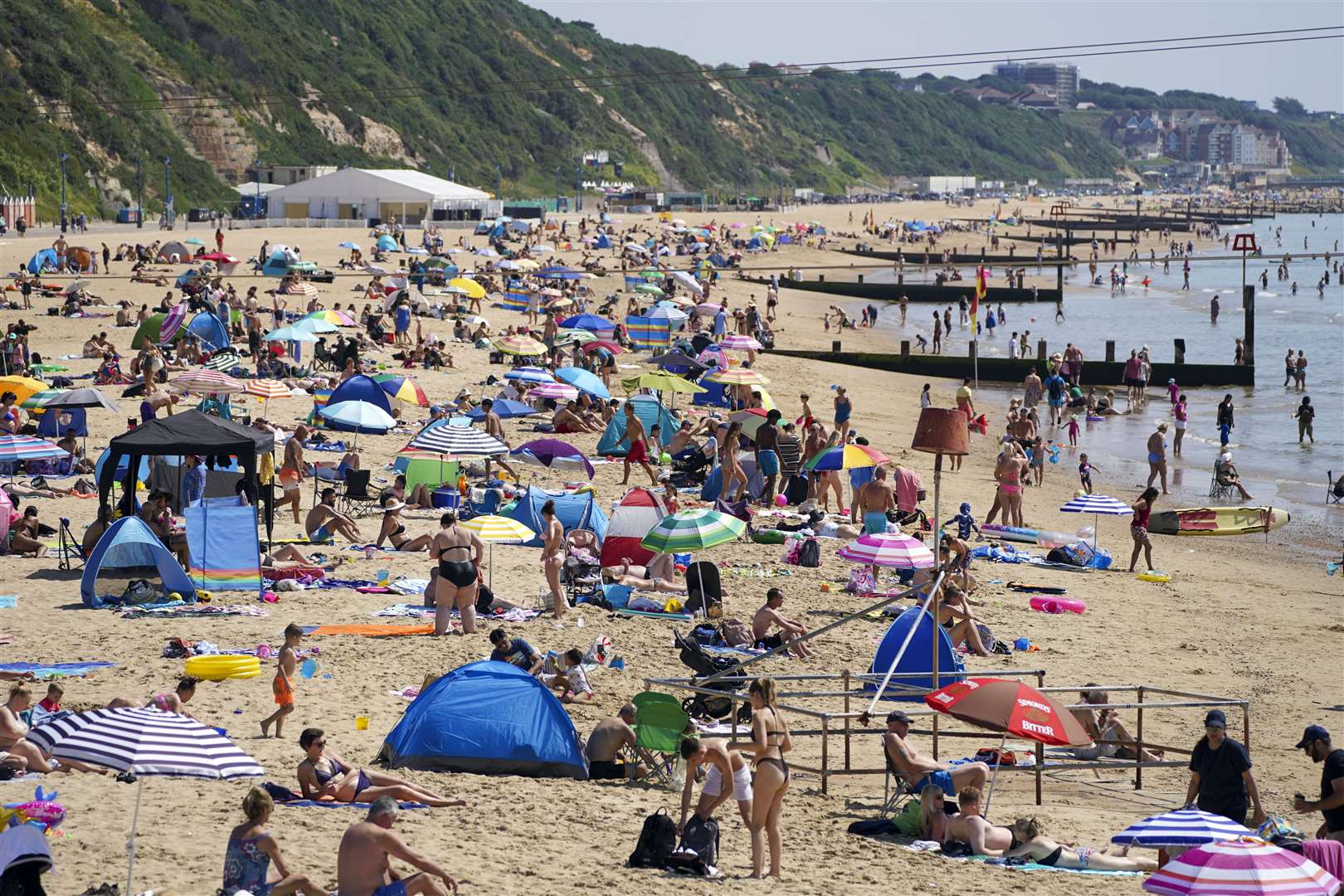 People enjoy the weather on Bournemouth beach (Steve Parsons/PA)