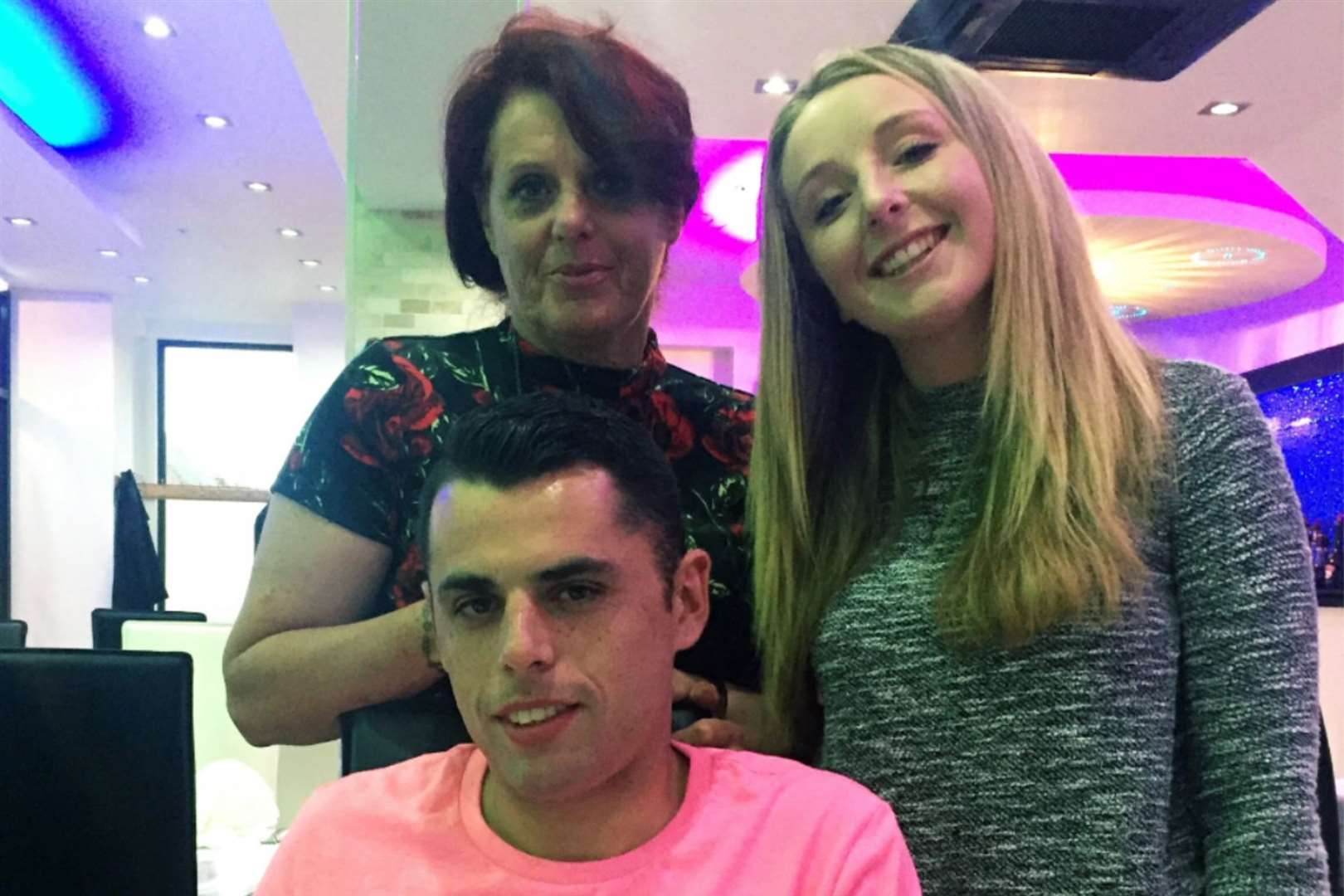 Stab victim Curtis Lewis with his mum Maxine and sister Morgan