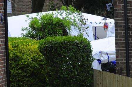 A police search tent in the back garden