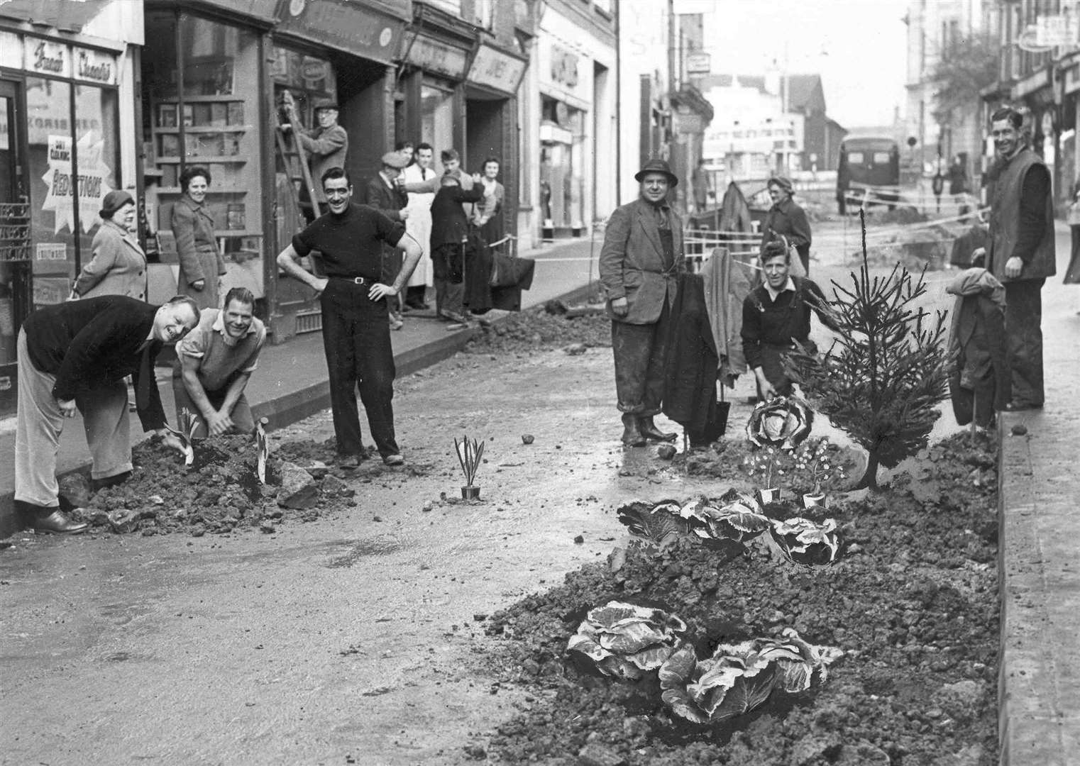 Traders in Week Street, Maidstone, became so exasperated at the time road repairs were taking in 1955 that they use the holes as places to plant trees, flowers and vegetables