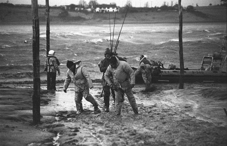 Anglers are landed from the lifeboat 'British Diver' after being taken off a fishing vessel which was aground and into difficulties in the entrance to The Swale during a storm on January 19, 1983. Picture: RNLI/Chris Davey