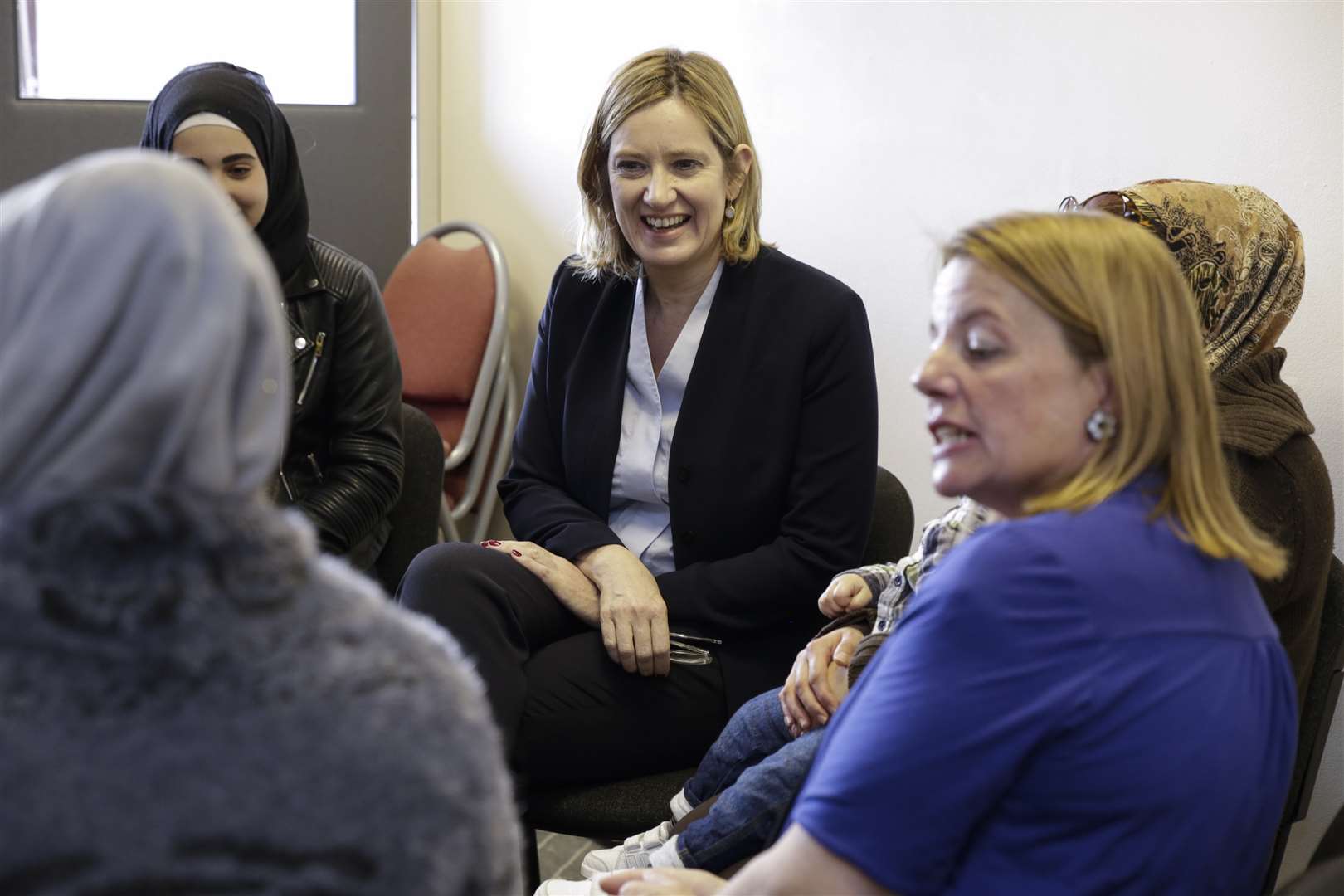 Amber Rudd meets some of the refugees.