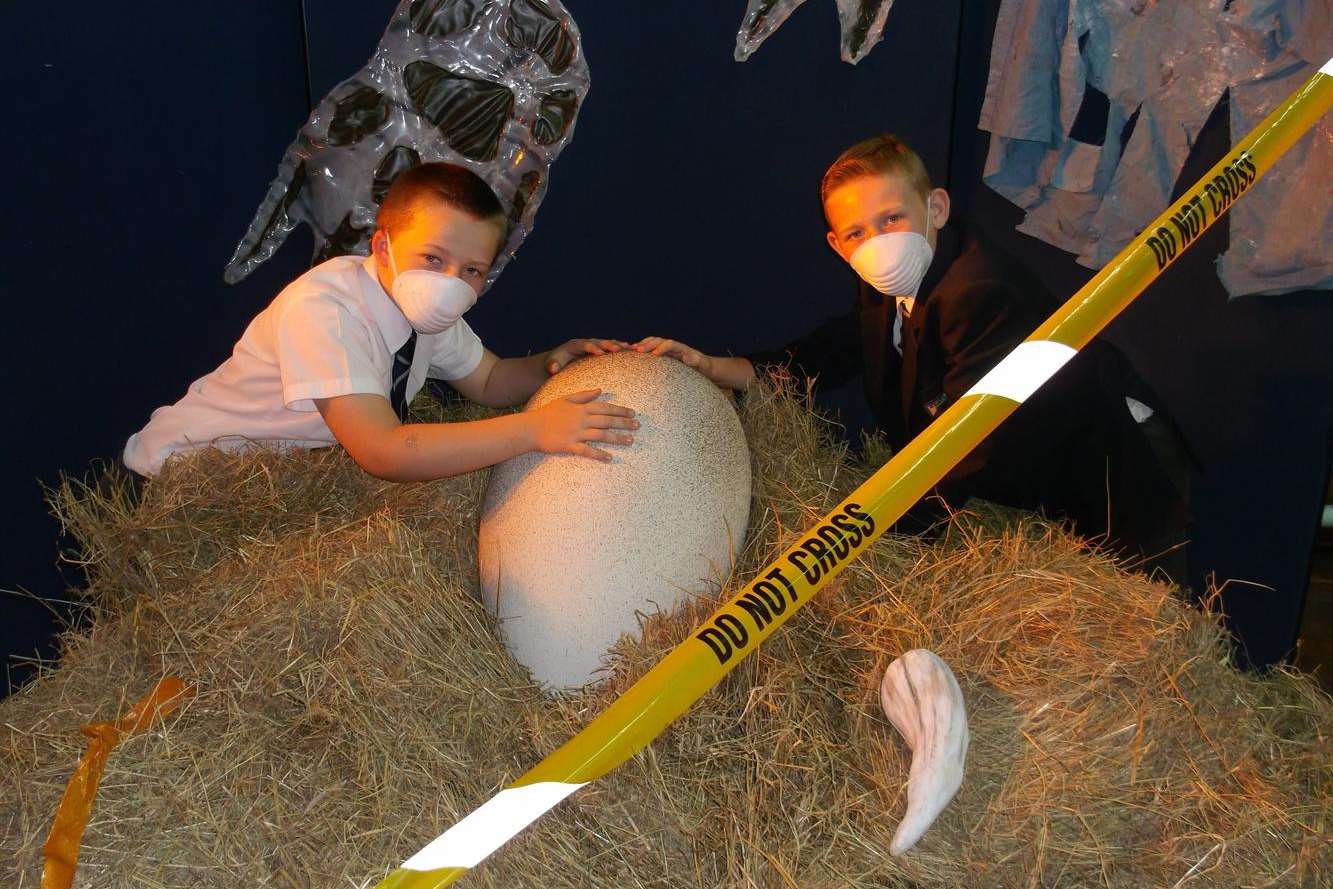 Year 6 pupils Riley Moroni and Braydon Gollop inspecting the egg in safety masks