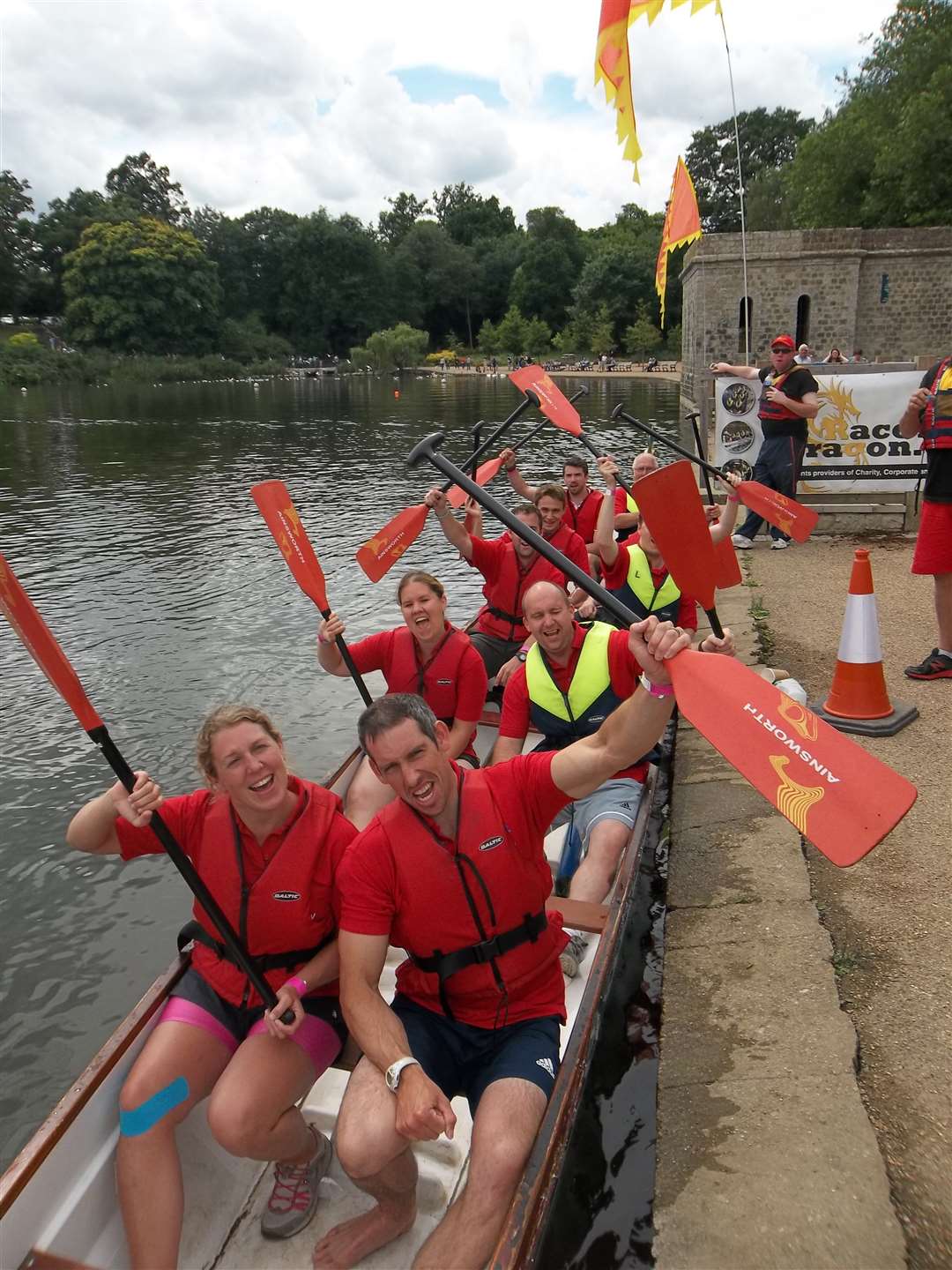 2012 olympic gold medal winning canoeist Etienne Stott (front right) celebrates with crew members of Hi Kent after winning the Minor Final at the KM Dragon Boat Race. The minor final involved teams that were placed 7 to 12 in the three heats