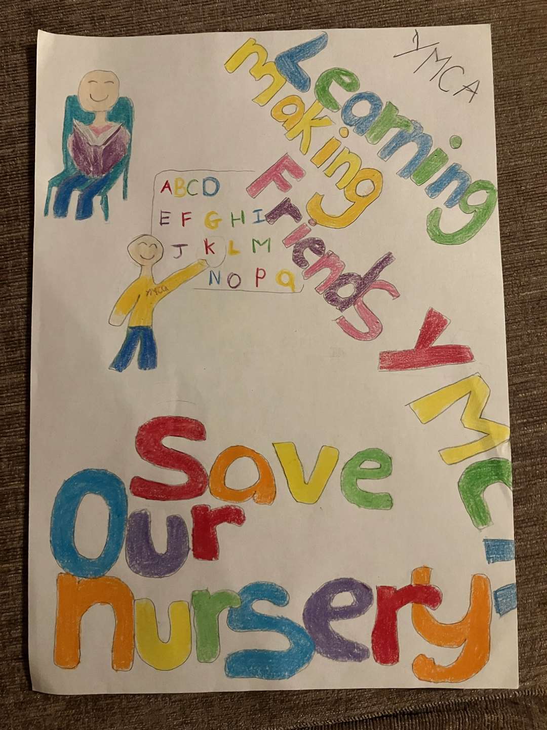 The children made posters in the hopes of saving their nursery. Picture: Kelly Cattermole
