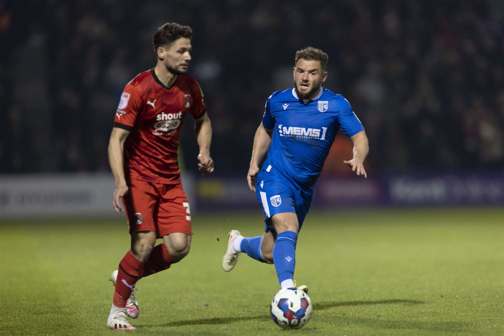 Alex MacDonald chasing down the ball for Gillingham against Leyton Orient