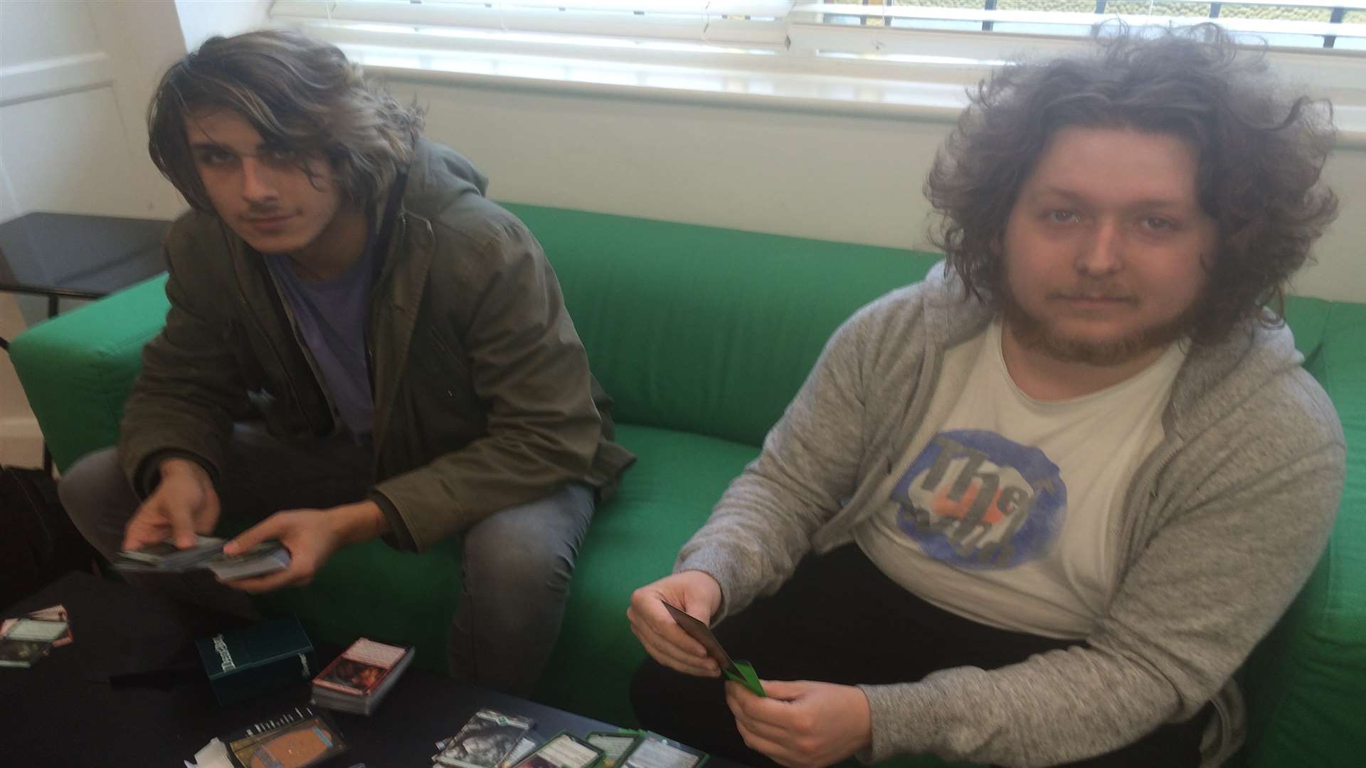 The Mug and Meeple gamer cafe. Luca Fallon, left, and William Order play a card game.