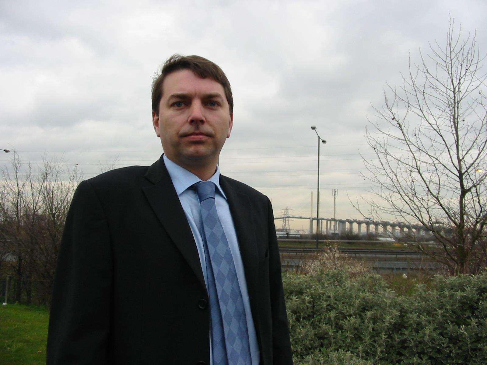 Gareth Johnson, Conservative candidate, points to Dartford Bridge and asks where has all the toll gate money gone? (2444581)