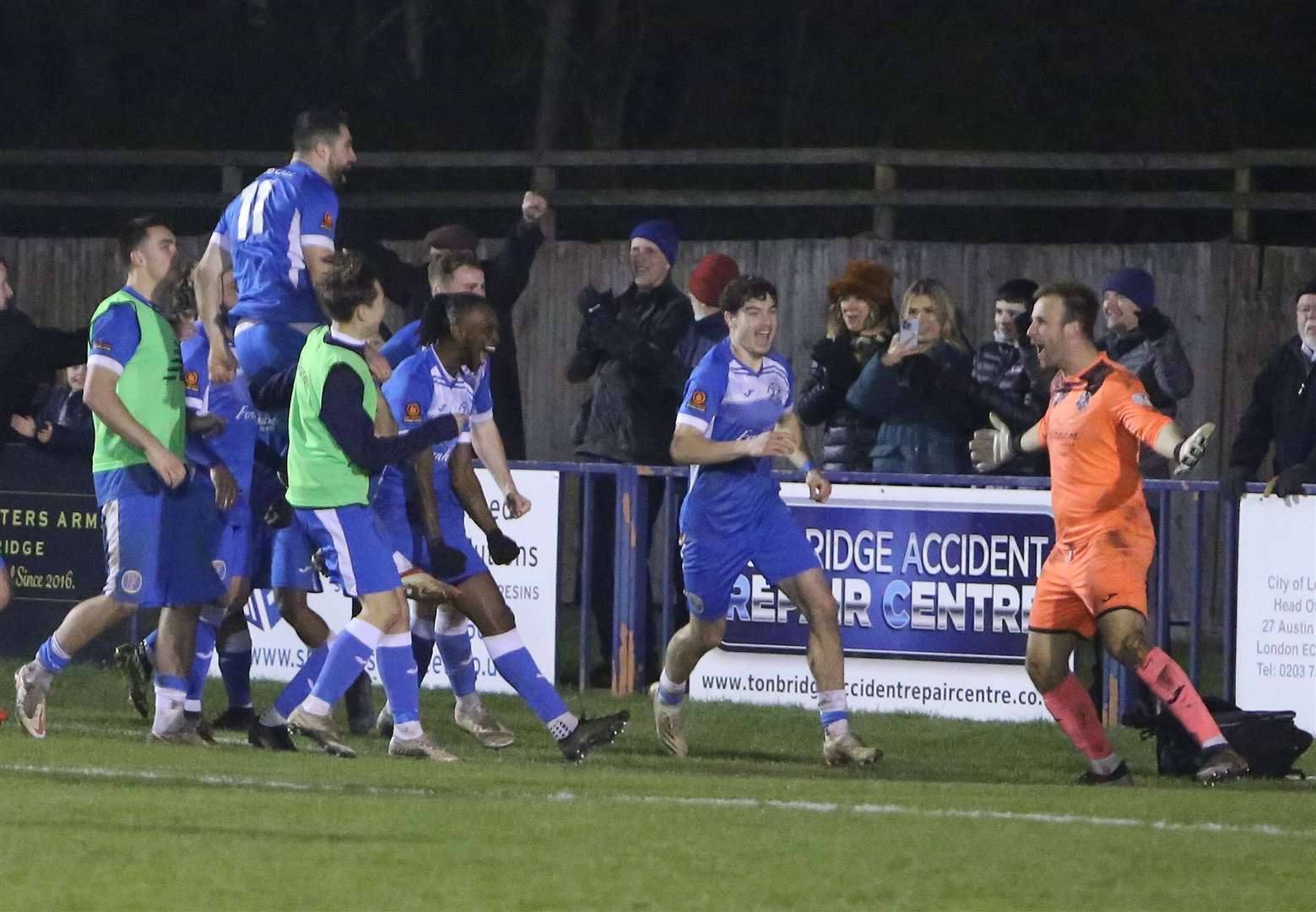 Goalkeeper Jonny Henly is about to be mobbed by Tonbridge team-mates after his penalty shoot-out heroics Picture: Dave Couldridge