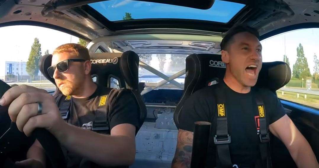 Warren Lees driving his BMW with Motor Addicts presenter Owen Forrest in the passenger seat. Picture: Motor Addicts / YouTube