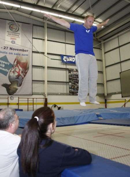 Kat Driscoll shows Alex Hoad how to trampoline.