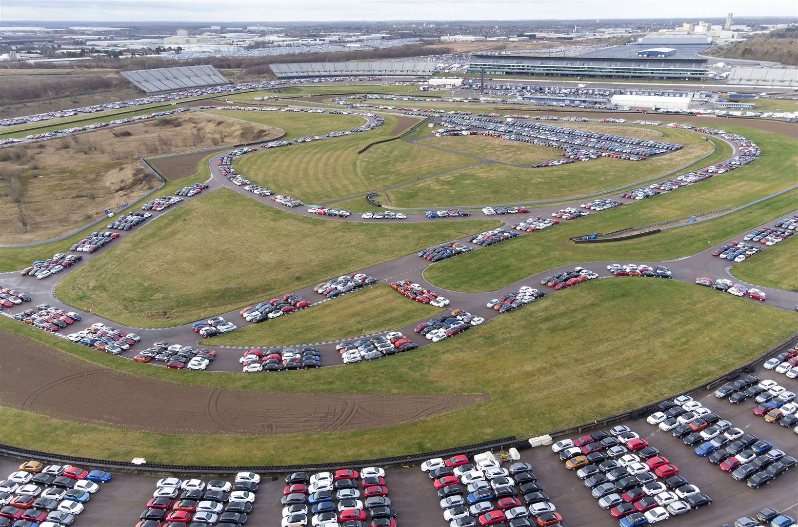 Used cars parked on the 250-acre former motorsport site (Joe Giddens/PA)