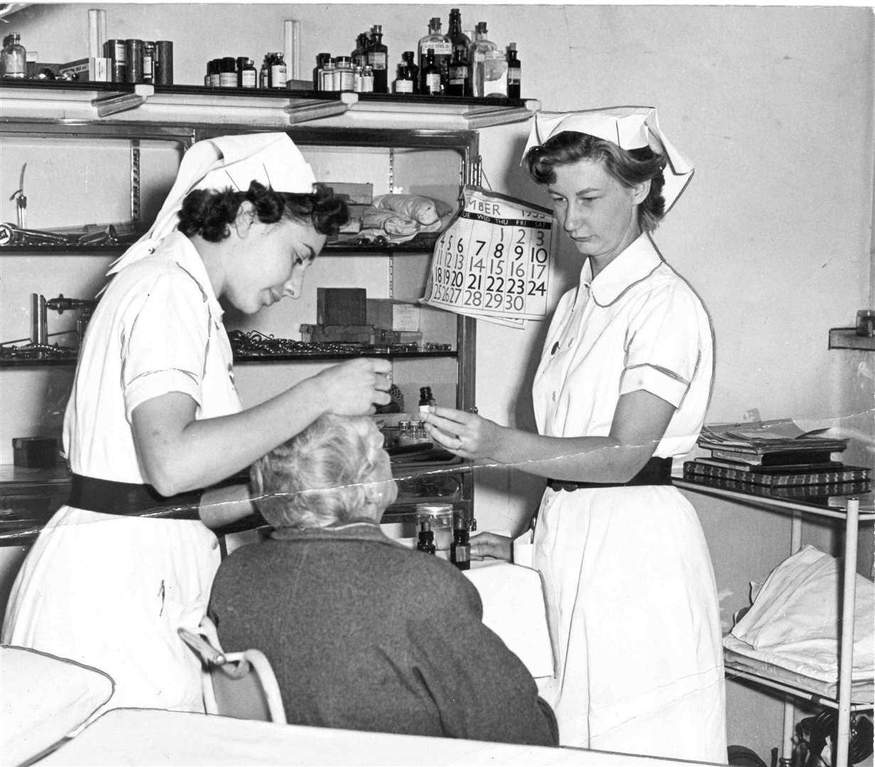 Nurses attending a patient in St Barts Hospital, Rochester, in 1955