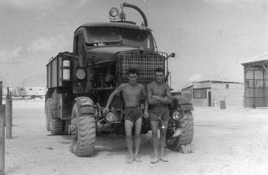 Mr Quinlan and a colleague with one of the trucks they drove