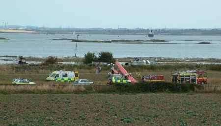 Emergency services free the pilot. Picture courtesy BOB RYAN