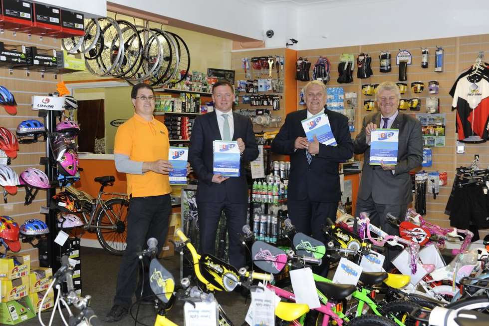 Geoff Smith of Romney Cycles, left, meets Damian Collins MP FSB's Bill Fox and Cllr Mark Dance