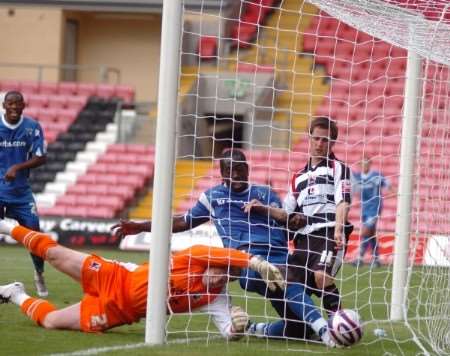 Mark McCammon slides in to make sure the Gills winner crosses the line. Picture: Matthew Reading