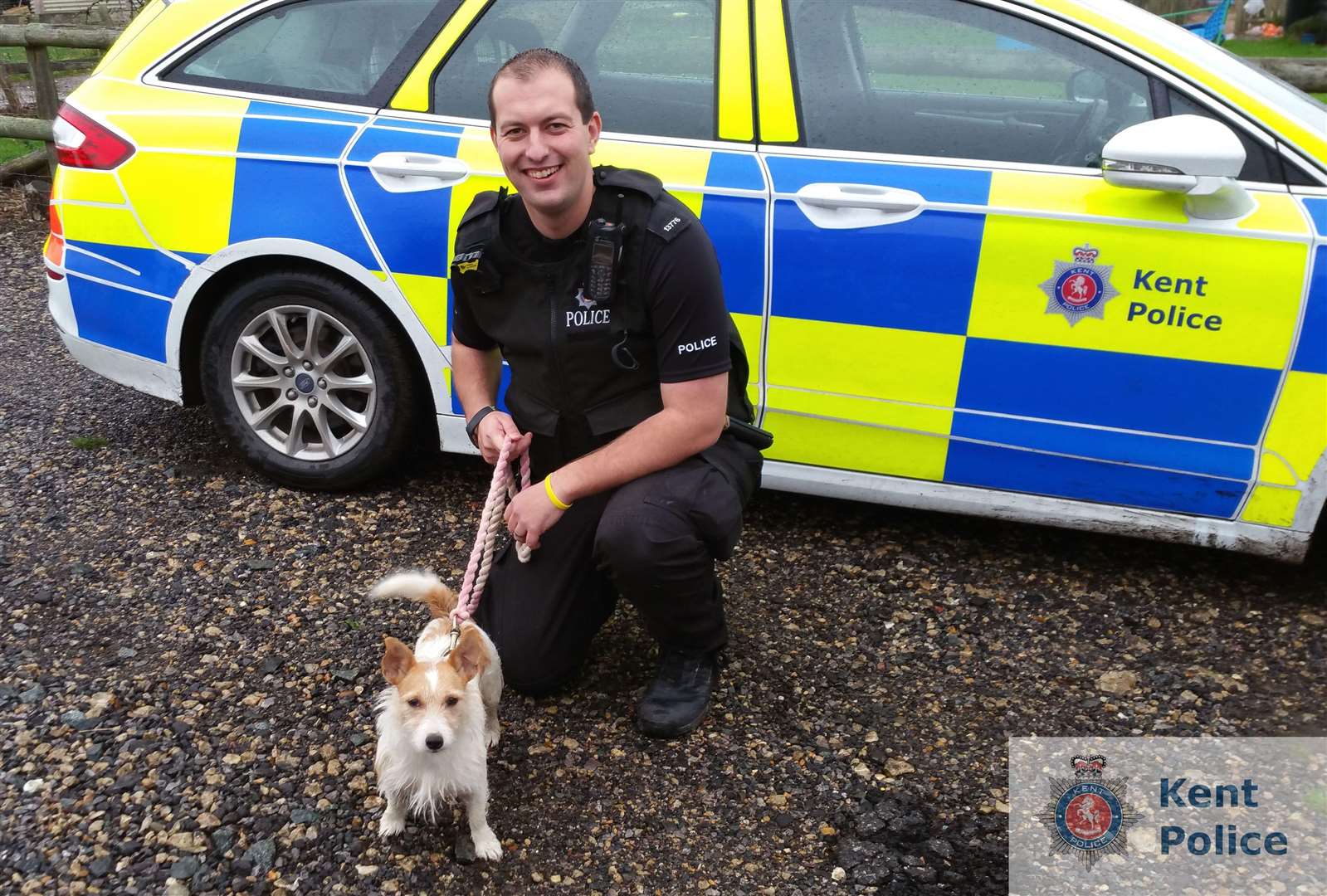 PC Nathan Southern with Peaches the dog who has been reunited with her owner after she was stolen