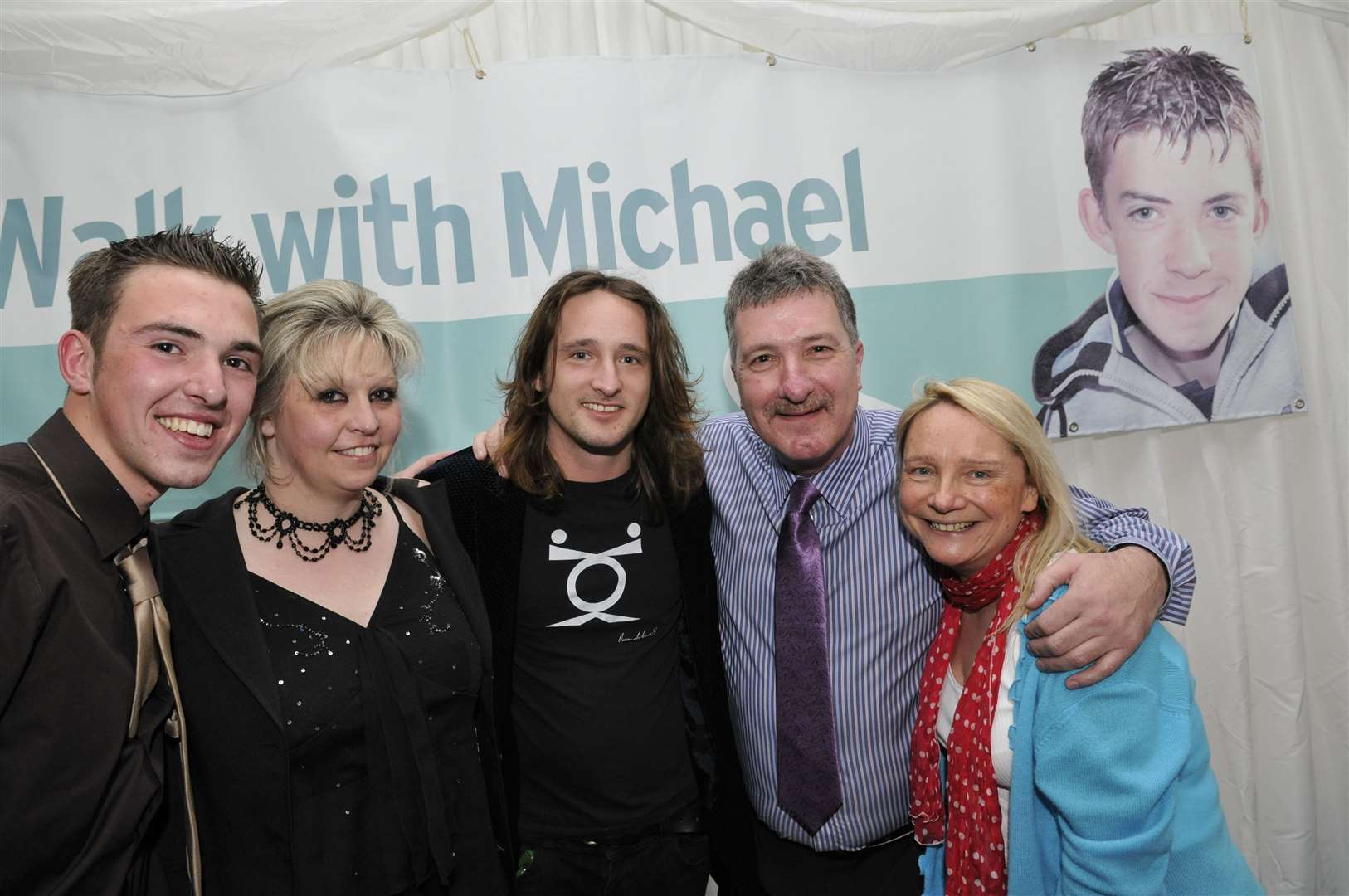 The Chapman family and VIP guests, from left David, mum Sue, X Factor's Ben Mills, dad Lloyd and Radio One DJ Lynn Parsons at a tribute party for Michael for what would have been his 18th birthday at The Woodstock, Broad Oak Road, Sittingbourne. Picture: Andy Payton