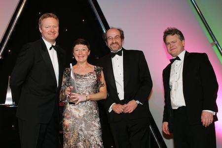 Maureen Connolly Tax partner with Reeves and Neylan exceps the best large practice tax team award from Rory Bremner left, and Mike Beament director of award sponsor Beament Leslie Thomas at the LexisNexis taxation awards in the London Hilton