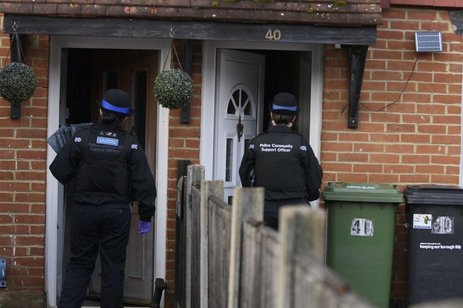 Officers deliver two kits in Mangravet Avenue, Maidstone during the door to door testing. Picture: Barry Goodwin