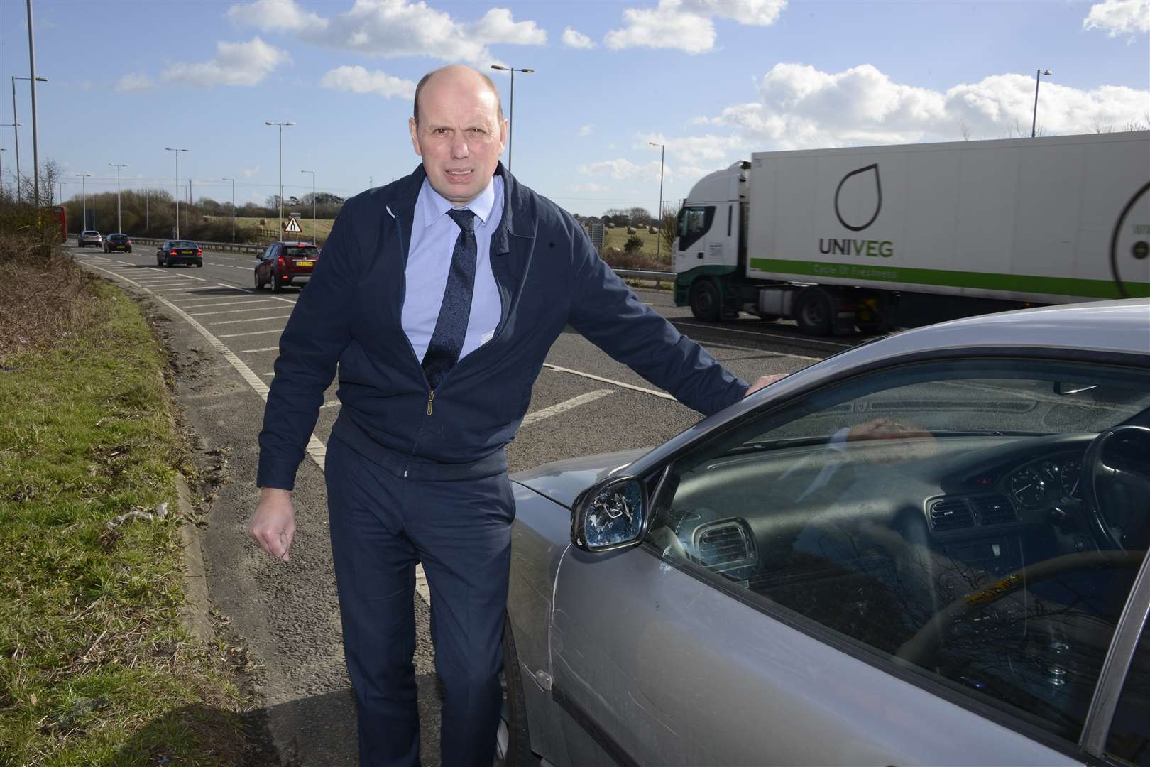 Mark Moorhouse and his damaged car caused by a lorry