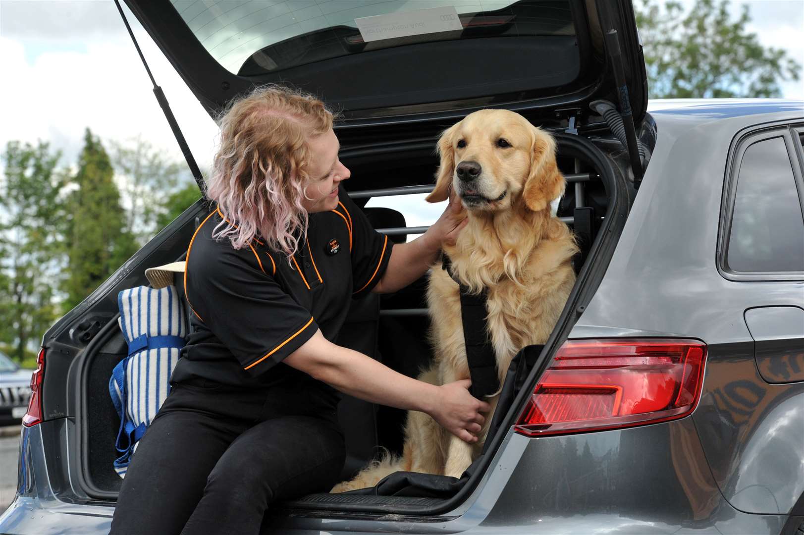 Boris the dog and Emily Hussey, the first Bark and Ride specialist at Halfords. Picture: Mikal Ludlow