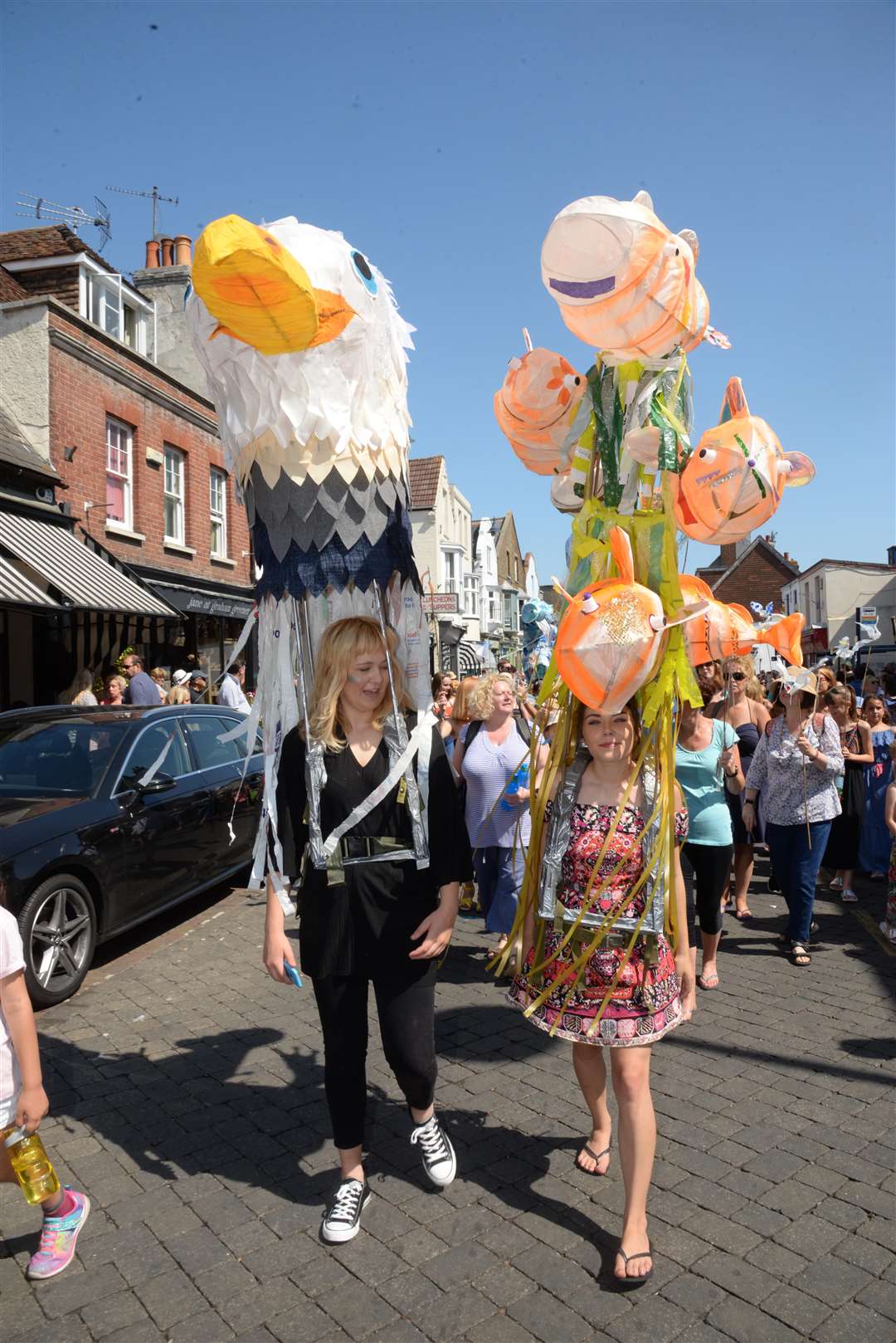 Colourfull and unusual head gear from the Horsebridge Centre in the Whitstable Oyster Festival parade as it makes it's way through the town on Saturday. Picture: Chris Davey... (3192434)