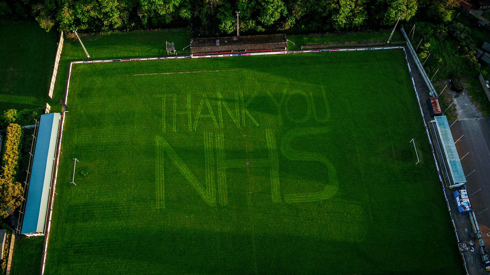 Groundsman Anthony Deer cut the message into the grass as a thank you to the NHS Picture: CPL Films