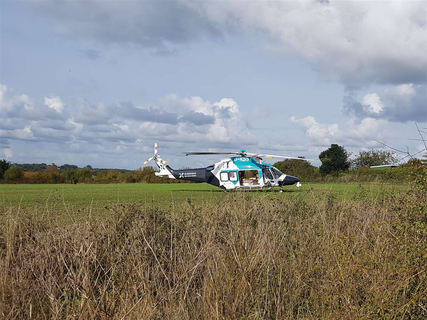 An air ambulance has landed in a field off Cross Road in Walmer