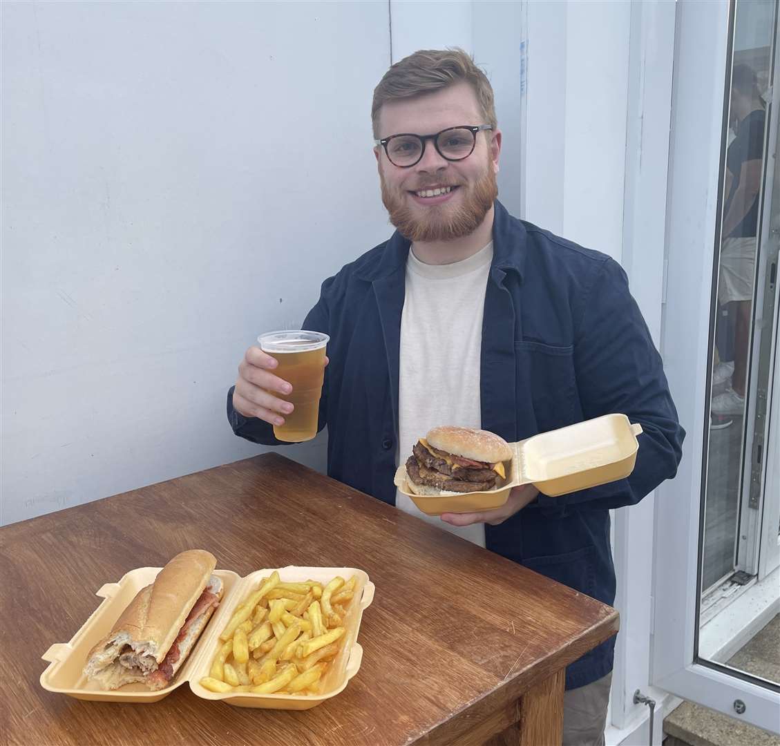 Reporter Sean McPolin enjoys a bite at Maidstone United's Gallagher Stadium