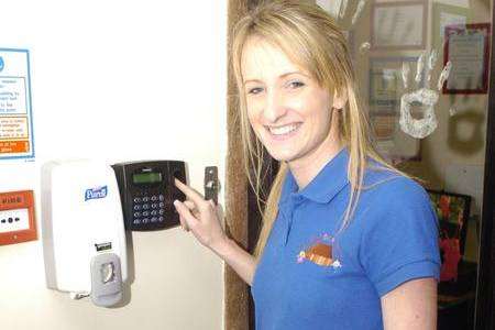 Gemma Capon, manager of Brishing Barn Nursery, with the nursery's new fingerprint scanner