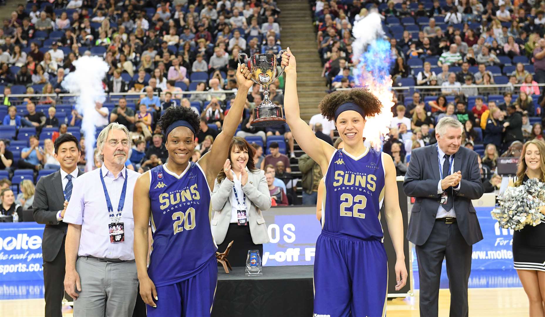 Ta’Yani Clark and Cat Carr holding aloft the Playoff final trophy at the O2