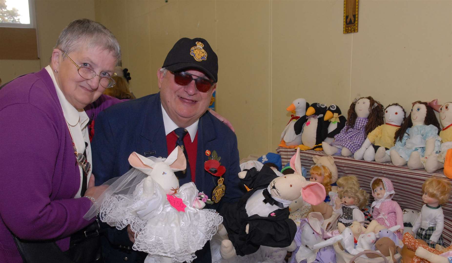 John Friday, who was president of the Sheppey branch of the Royal British Legion, pictured in 2007 helping out Valerie Sands on a soft toy stall at a coffee morning