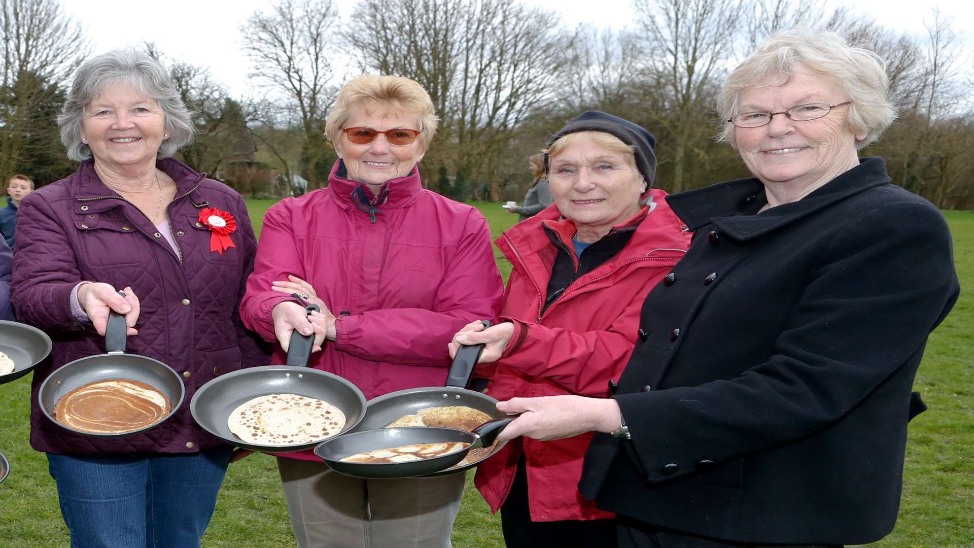Val Williams (pictured right) with other members of the WI at the village pancake race