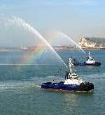 The Dover Harbour Board tugs salute the ship's arrival