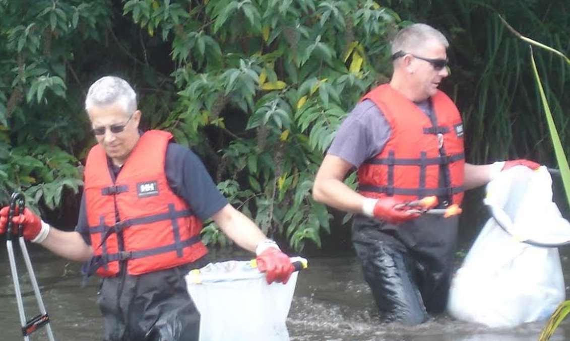 Volunteers went wading in the river collecting around 40 bags worth of rubbish. Picture: Sue Bradford