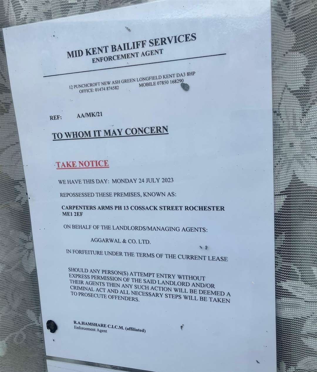 A bailiff's notice posted outside the pub