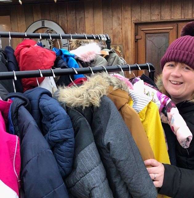 Louise Hampton with some of the coats she has collected