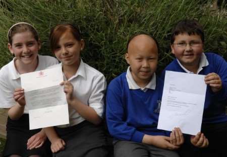 Ban the Bag campaigners from The Downs School, from left, Chloe Dunne, Alana Carballido, Jun Nam Shek and Jack Wahl with their letters from the Queen and Jamie Oliver