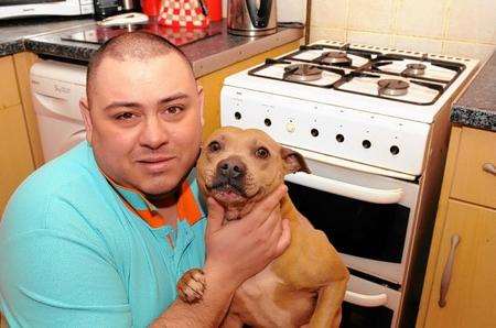 Dev Banerjee with dog Sandy, after the family were forced to flee family home in gas leak.