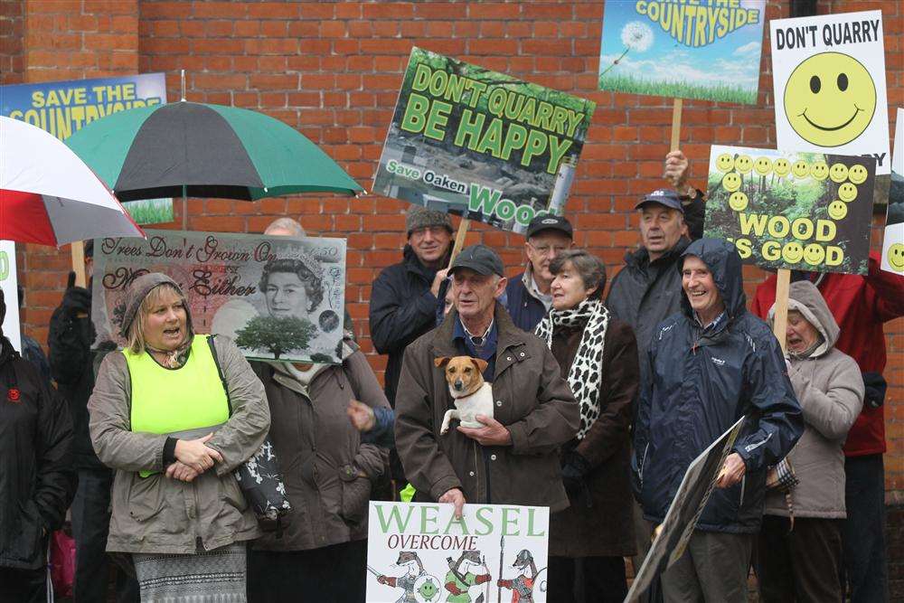Demonstrators from the Oaken Wood Action Group outside the public inquiry