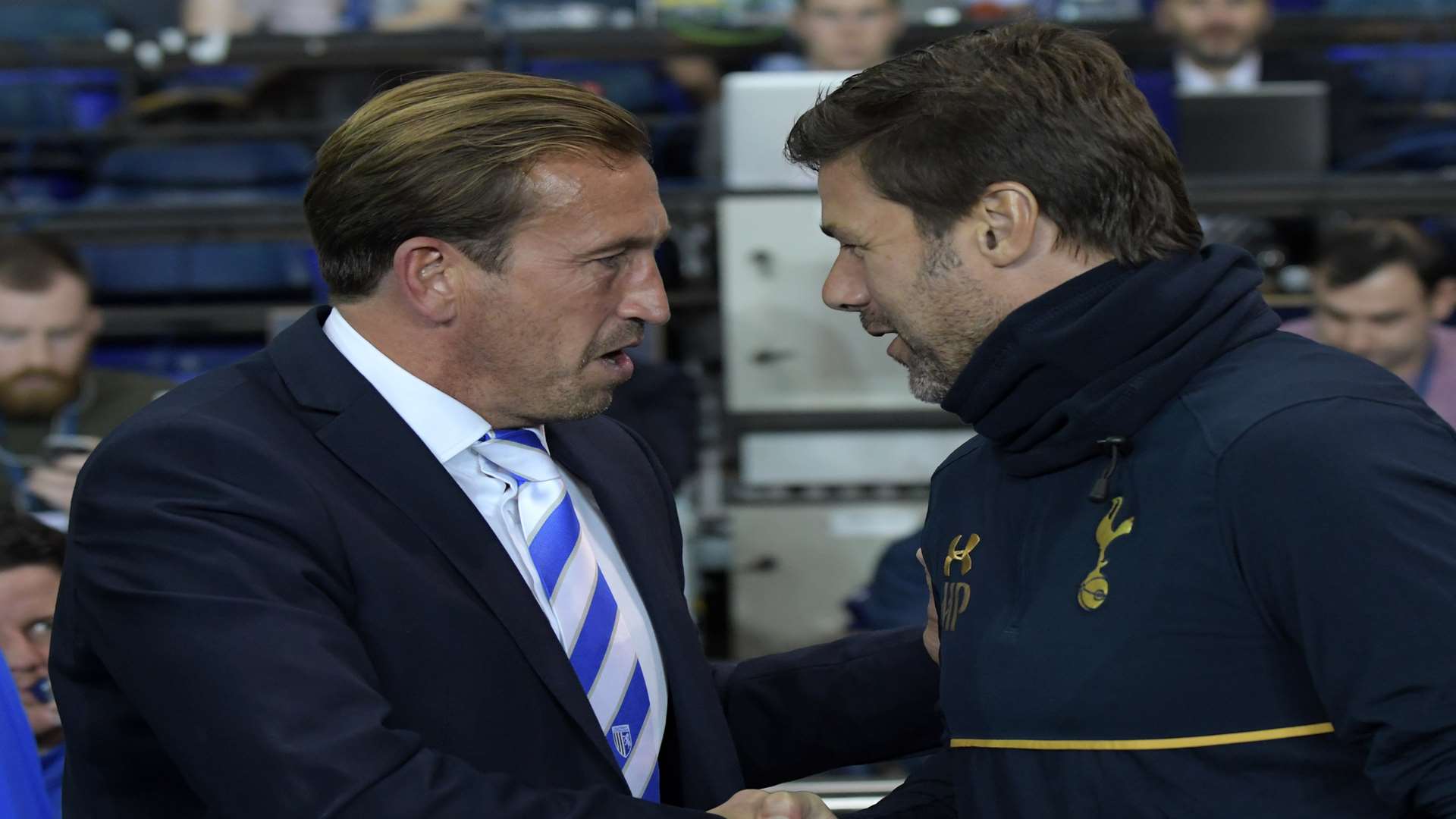 Gills boss Justin Edinburgh shakes hands with Spurs manager Mauricio Pochettino Picture: Barry Goodwin