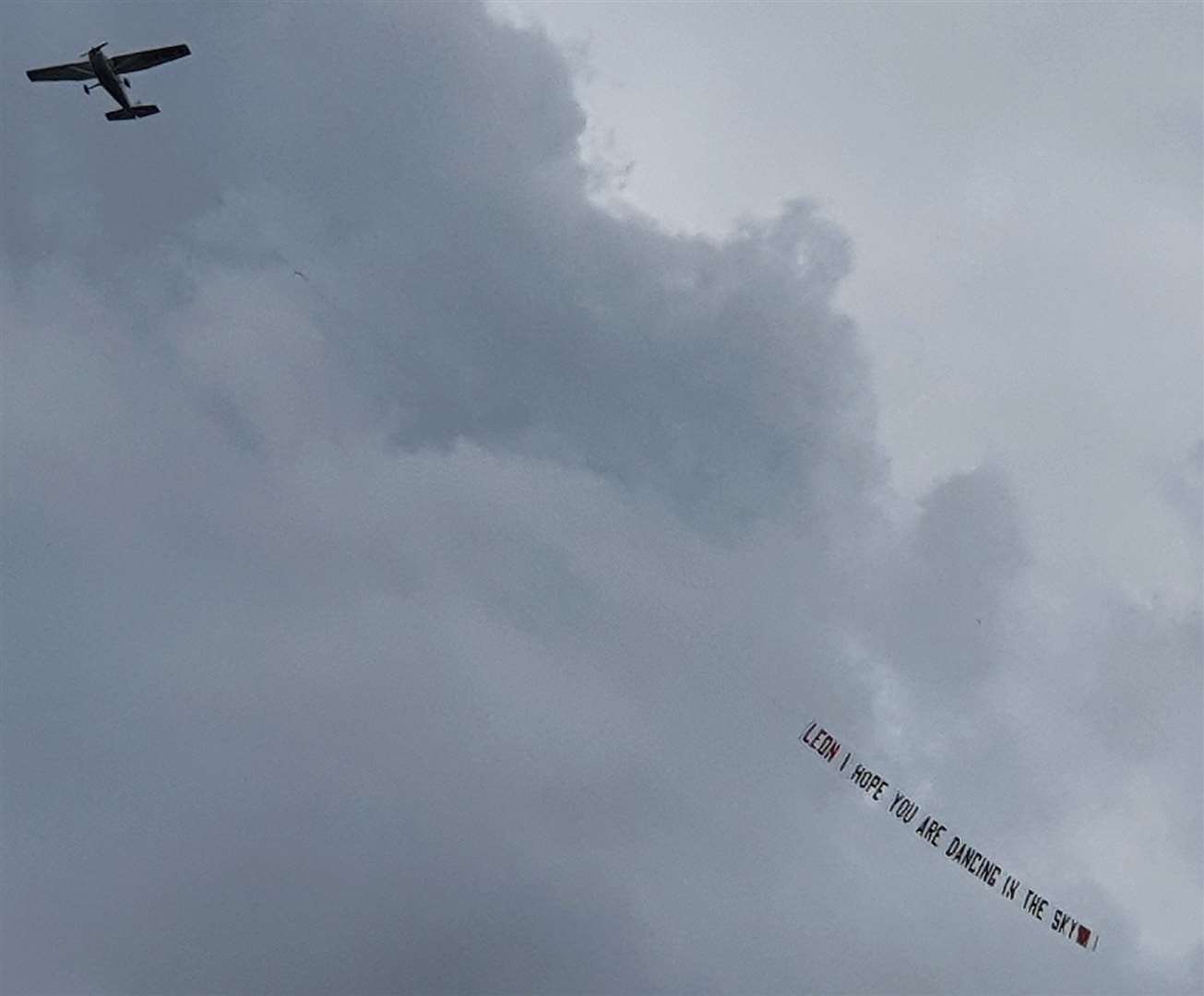 A plane paid tribute to Leon Junior on the day of his funeral in June