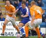 Mike Flynn takes on Blackpool's Keith Southern. Picture: GRANT FALVEY