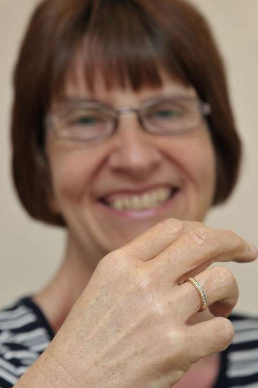 A slimmed-down Bev Wright shows off her nine-diamond ring