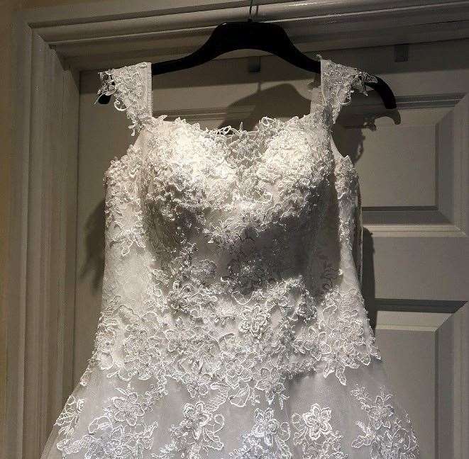 The bodice of the wrong gown, pictured, is similar to Michelle's wedding dress
