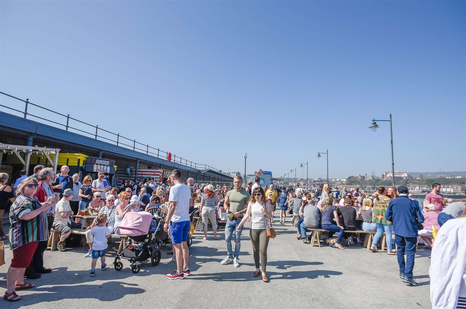 Crowds flock to the Folkestone Harbour Arm - one of many attractions luring daytrippers to the Kent coast on high-speed trains. Picture: Alan Langley