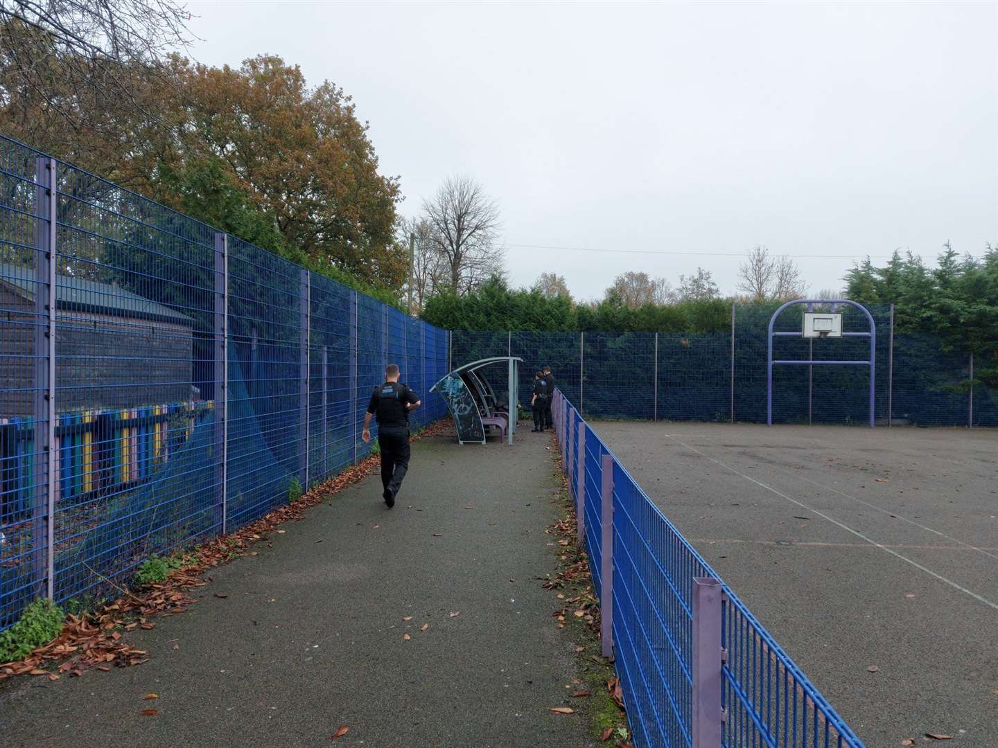 Officers searching the basketball courts in Victoria Park as part of patrols. Photo: Kent Police