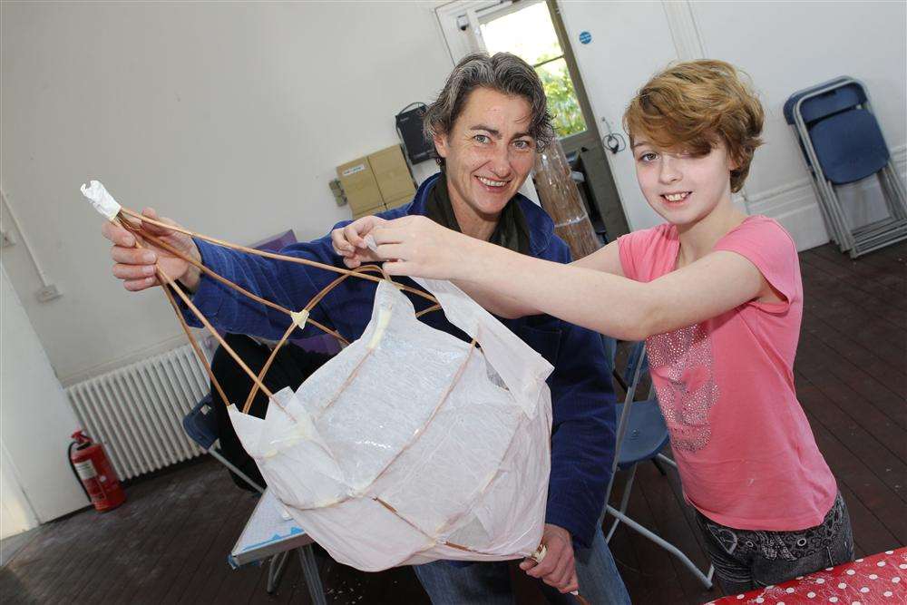 Laurie Harpum and Heaven Bassett, 11, making lanterns at a workshop organised by Big Fish Arts at Restoration Youth in Sheerness